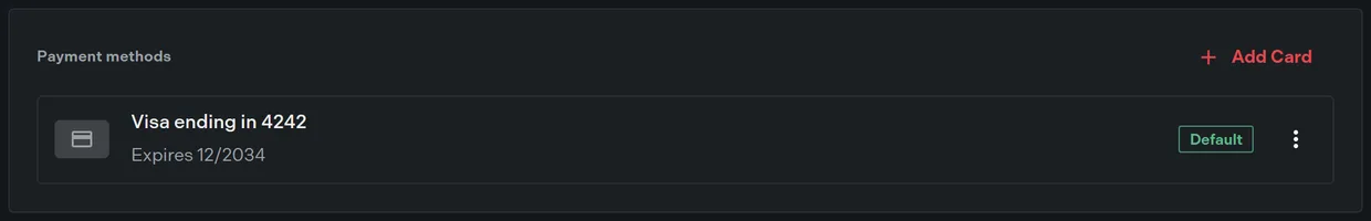 The payment methods section listing a saved card with the default chip