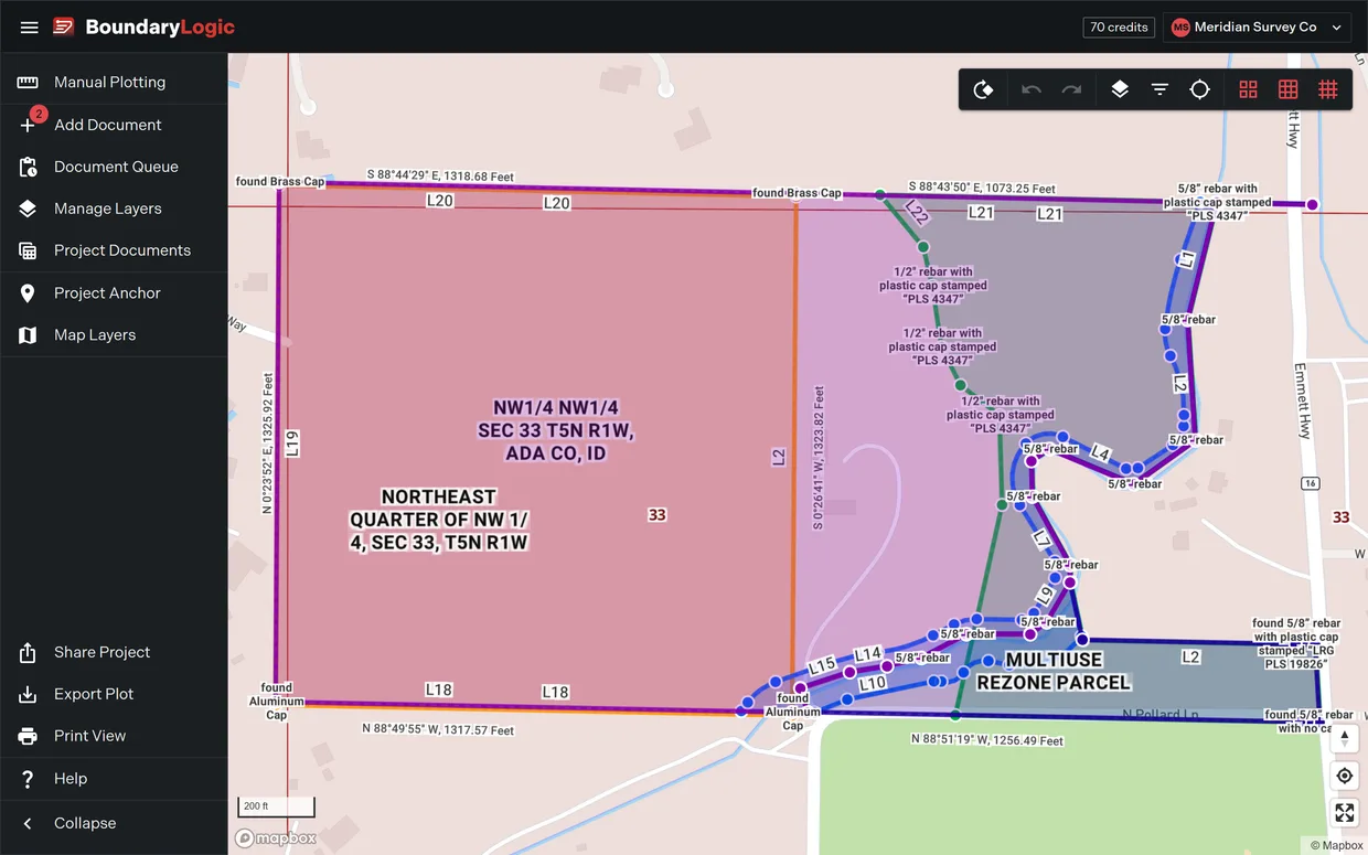 A plotted boundary standing on its PLSS corner on the map with the township, section and quarter grids drawn